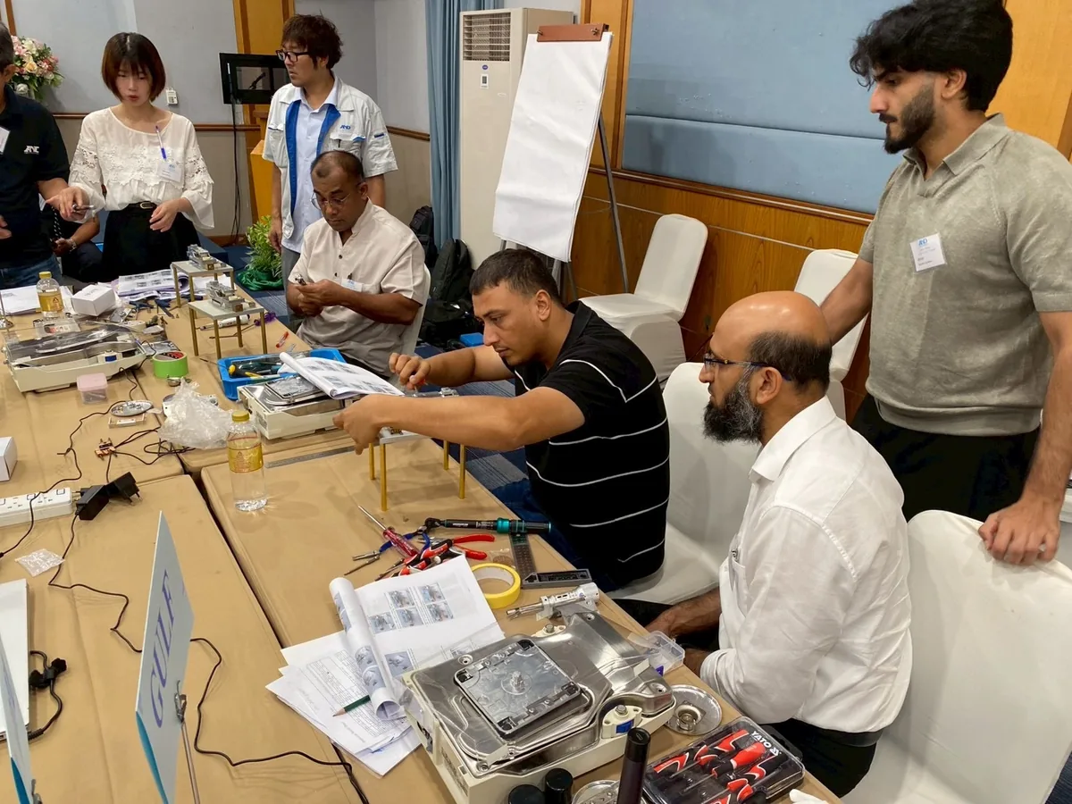 A&D Gulf engineers dismantling and servicing A&D balances with tools and service manuals during the Thailand training